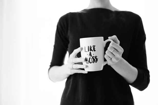 Leading through a crisis woman with like a boss mug